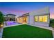 A well manicured lawn, patio and pool create a wonderful outdoor space at 11895 Skyline Arch Ct, Las Vegas, NV 89138