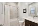 This bathroom features a shower-tub, modern fixtures, and a clean design with a neutral color palette at 11895 Skyline Arch Ct, Las Vegas, NV 89138