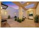 Picturesque courtyard with a stone pillar, skylight, and view into the home at 11895 Skyline Arch Ct, Las Vegas, NV 89138