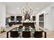 Open-concept dining room with designer lighting and connection to the kitchen at 11895 Skyline Arch Ct, Las Vegas, NV 89138