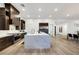 Spacious, modern kitchen with a large island, stainless steel appliances, and hardwood floors at 11895 Skyline Arch Ct, Las Vegas, NV 89138