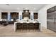 Stunning kitchen with a large island, bar seating, and stainless steel appliances at 11895 Skyline Arch Ct, Las Vegas, NV 89138