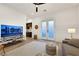 Stylish living room with a large TV, comfortable seating, and a wet bar for entertaining guests at 11895 Skyline Arch Ct, Las Vegas, NV 89138