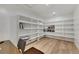 Large walk-in pantry with custom shelving and hardwood floors at 11895 Skyline Arch Ct, Las Vegas, NV 89138