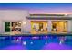 Inviting pool with views of outdoor living spaces and the home's contemporary design at 11895 Skyline Arch Ct, Las Vegas, NV 89138