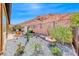 Landscaped backyard featuring desert plants, gravel, and mountain views at 125 Mirage View Dr, Henderson, NV 89011