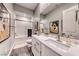 Bright bathroom with subway tile shower, white vanity, and stylish decor at 125 Mirage View Dr, Henderson, NV 89011