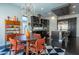 Open-concept dining space with views of a modern kitchen and stylish mid-century decor at 125 Mirage View Dr, Henderson, NV 89011