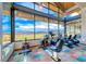 Well-equipped gym with modern exercise equipment and expansive windows showcasing panoramic views at 125 Mirage View Dr, Henderson, NV 89011