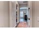 Hallway with arched doorways provides seamless transitions between rooms with modern flooring at 125 Mirage View Dr, Henderson, NV 89011