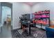Functional home office setup with a modern desk, shelving, and neutral decor at 125 Mirage View Dr, Henderson, NV 89011