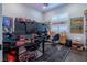 Spacious home office with dual monitors, shuttered windows, and comfortable seating at 125 Mirage View Dr, Henderson, NV 89011