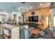 Open-concept living area featuring modern decor, a stylish seating arrangement, and seamless flow to other spaces at 125 Mirage View Dr, Henderson, NV 89011
