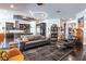 Open-concept living room with sleek furnishings, modern lighting, and a seamless transition to the kitchen at 125 Mirage View Dr, Henderson, NV 89011