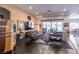 Stylish living room featuring wood floors, modern furnishings, and sliding doors at 125 Mirage View Dr, Henderson, NV 89011