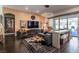 Stylish living room featuring unique decor, comfortable seating, and a seamless indoor-outdoor flow at 125 Mirage View Dr, Henderson, NV 89011