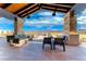 Spacious covered patio with stylish furniture and views of the surrounding landscape at 125 Mirage View Dr, Henderson, NV 89011
