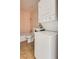 Compact bathroom showcasing a stackable washer and dryer unit for space-saving convenience at 1309 Dorothy Ave # 4, Las Vegas, NV 89119