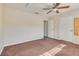 Bedroom with ceiling fan, plush carpeting, neutral walls, and three separate closets at 1309 Dorothy Ave # 4, Las Vegas, NV 89119