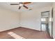 Bedroom featuring plush carpeting, ceiling fan, neutral walls, and ample sunlight at 1309 Dorothy Ave # 4, Las Vegas, NV 89119
