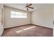 Bright bedroom with ceiling fan, plush carpeting, and natural light from the window at 1309 Dorothy Ave # 4, Las Vegas, NV 89119