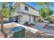A charming two-story home with a front yard featuring trees and desert landscaping at 1309 Dorothy Ave # 4, Las Vegas, NV 89119