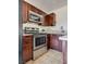 Stainless steel appliances and dark wood cabinets complement this bright kitchen at 1309 Dorothy Ave # 4, Las Vegas, NV 89119