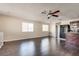 Open-concept living room with hardwood flooring provides views of the kitchen and backyard at 1309 Dorothy Ave # 4, Las Vegas, NV 89119