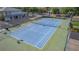 Overhead view of a tennis court with well-maintained surfacing and surrounding vegetation at 1309 Dorothy Ave # 4, Las Vegas, NV 89119
