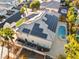 Backyard view featuring a sparkling pool and spa alongside a home equipped with energy-efficient solar panels at 1316 Eagle Meadow Ct, Las Vegas, NV 89123