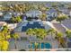 Spacious backyard featuring a sparkling blue pool and spa, framed by palm trees, offering a serene outdoor experience at 1316 Eagle Meadow Ct, Las Vegas, NV 89123