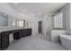 Elegant bathroom with a soaking tub, shower and dual vanities at 1316 Eagle Meadow Ct, Las Vegas, NV 89123