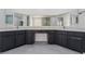 Dual vanities with stone countertops in a well-lit bathroom at 1316 Eagle Meadow Ct, Las Vegas, NV 89123