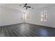 Spacious bedroom with plenty of natural light, ceiling fan, and laminate flooring at 1316 Eagle Meadow Ct, Las Vegas, NV 89123