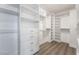 A spacious walk-in closet features custom shelves and drawers for organized storage at 1316 Eagle Meadow Ct, Las Vegas, NV 89123
