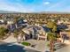 Expansive house showcasing desert landscaping, a tile roof, and solar panels amidst a beautiful neighborhood setting at 1316 Eagle Meadow Ct, Las Vegas, NV 89123