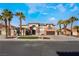 A beautiful two-story home showcasing the well-manicured yard with an inviting entrance and palm trees at 1316 Eagle Meadow Ct, Las Vegas, NV 89123