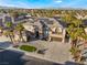 Stunning two-story home with a symmetrical facade, desert landscaping, and a multi-car garage, perfect for luxury living at 1316 Eagle Meadow Ct, Las Vegas, NV 89123