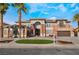 Attractive two-story home featuring stone accents, a circular lawn, and well-maintained landscaping at 1316 Eagle Meadow Ct, Las Vegas, NV 89123