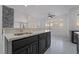 Open kitchen with a marble island, and stainless steel faucet with natural lighting at 1316 Eagle Meadow Ct, Las Vegas, NV 89123