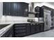 Modern kitchen featuring stainless steel appliances, gray cabinets, and white marble countertops at 1316 Eagle Meadow Ct, Las Vegas, NV 89123