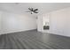 Spacious living room with wood floors and a modern ceiling fan at 1316 Eagle Meadow Ct, Las Vegas, NV 89123