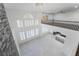 Open concept living area featuring a stone fireplace and high ceilings with lots of windows at 1316 Eagle Meadow Ct, Las Vegas, NV 89123