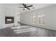 Modern living room with a fireplace and large windows at 1316 Eagle Meadow Ct, Las Vegas, NV 89123