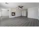Cozy living area with a fireplace and gray wood flooring at 1316 Eagle Meadow Ct, Las Vegas, NV 89123