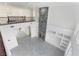 Spacious open-plan living area with fireplace, chandelier, and plenty of natural light at 1316 Eagle Meadow Ct, Las Vegas, NV 89123
