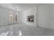 Bright living room with tiled floors, a modern fireplace, and French doors leading outside at 1316 Eagle Meadow Ct, Las Vegas, NV 89123