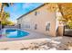 Sparkling pool and spa combination in backyard oasis near two-story home at 1316 Eagle Meadow Ct, Las Vegas, NV 89123
