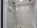 A glass enclosed shower has dual shower heads, tile accents, and streams of natural light at 1316 Eagle Meadow Ct, Las Vegas, NV 89123