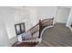 Elegant curved staircase with dark wood railings and treads leads to the upper level at 1316 Eagle Meadow Ct, Las Vegas, NV 89123